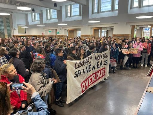 Uni workers at a meeting